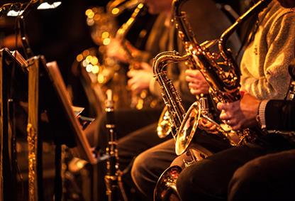 Group of people playing saxophone