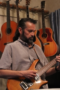 Mark Black playing guitar